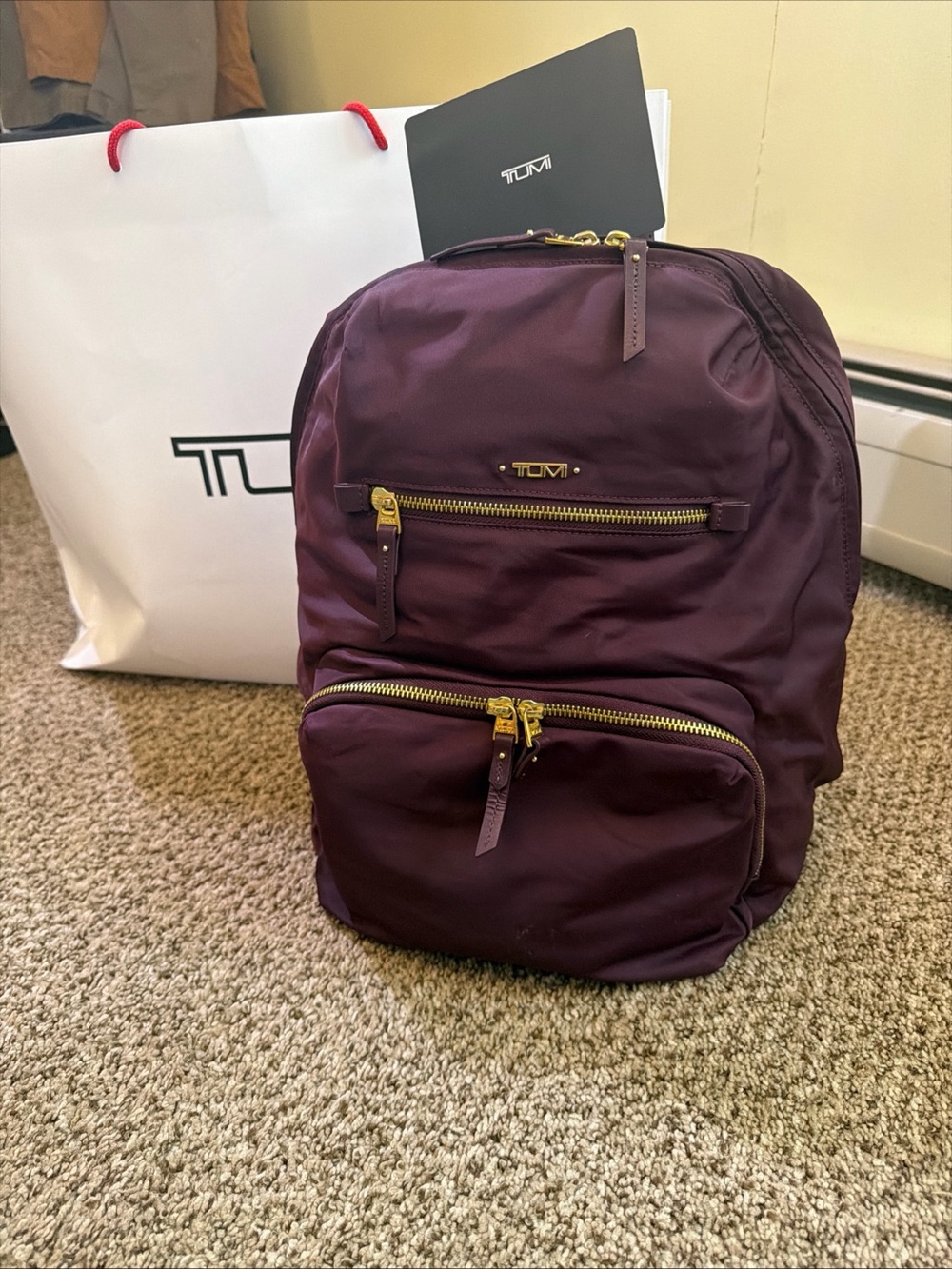 Tumi women’s Plum Backpack with Gold Hardware